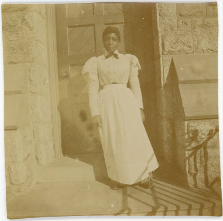 A maid on the steps of Merion Hall, ca. 1898.