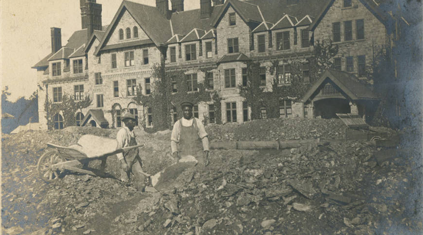 Two laborers working on Merion Hall ca. 1903. | Bryn Mawr College Special Collections, Bryn Mawr, PA.